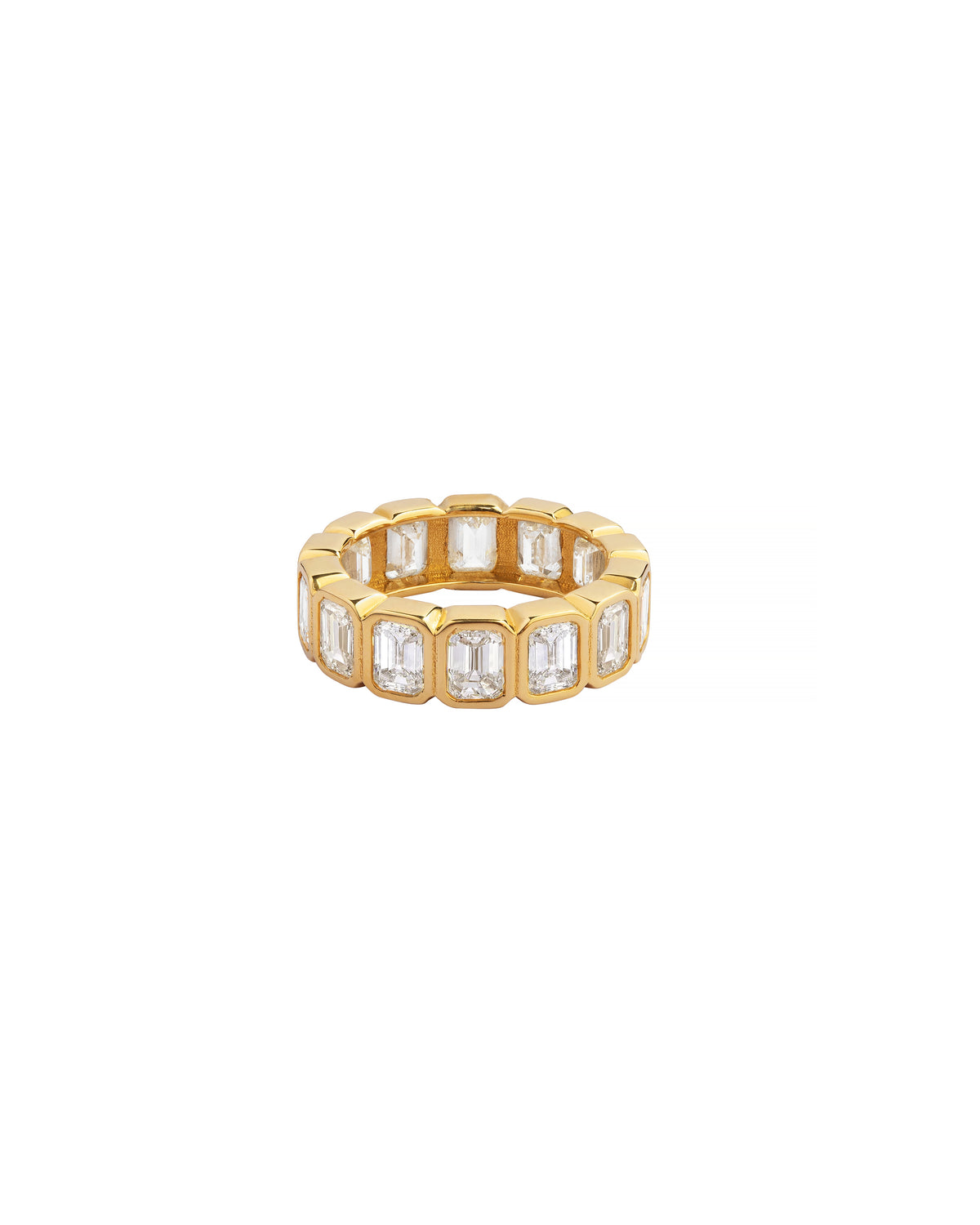 Gold ring with rectangular gemstones on a white background